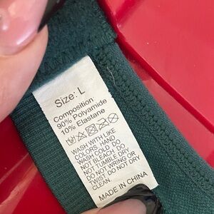 Green Garment with Red Accent